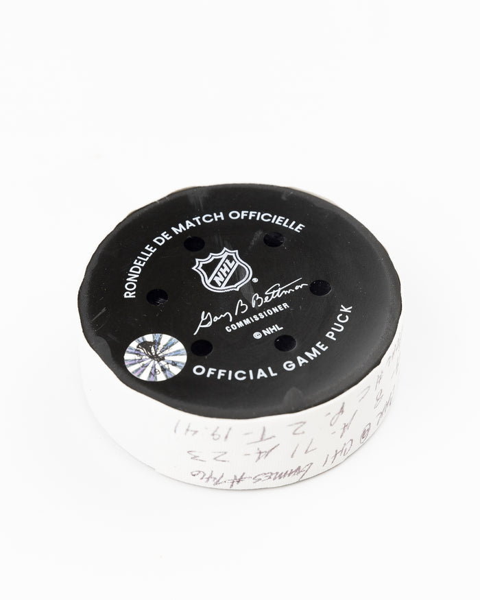 official Chicago Blackhawks game used goal puck scored by Ryan Donato against the Carolina Hurricanes on January 20, 2025 - back angle lay flat