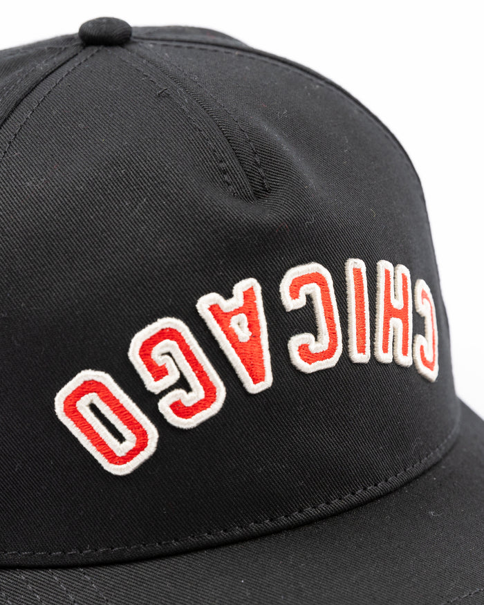black American Needle adjustable Roscoe hat with upside down Chicago wordmark embroidered on front and Chicago Blackhawks primary logo embroidered on left side - front detail lay flat