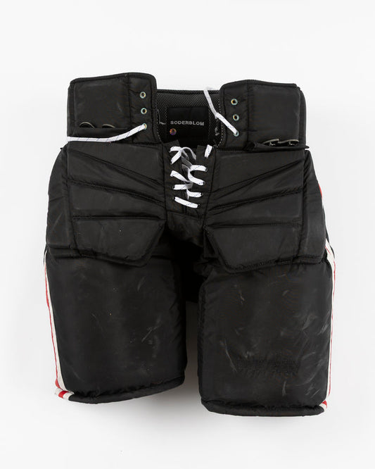black Vaugh hockey pants used by Chicago Blackhawks goalie Arvid Soderblom - front lay flat