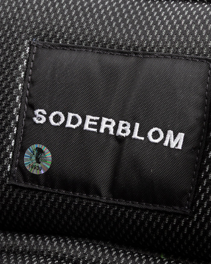 black Vaugh hockey pants used by Chicago Blackhawks goalie Arvid Soderblom - name detail lay flat