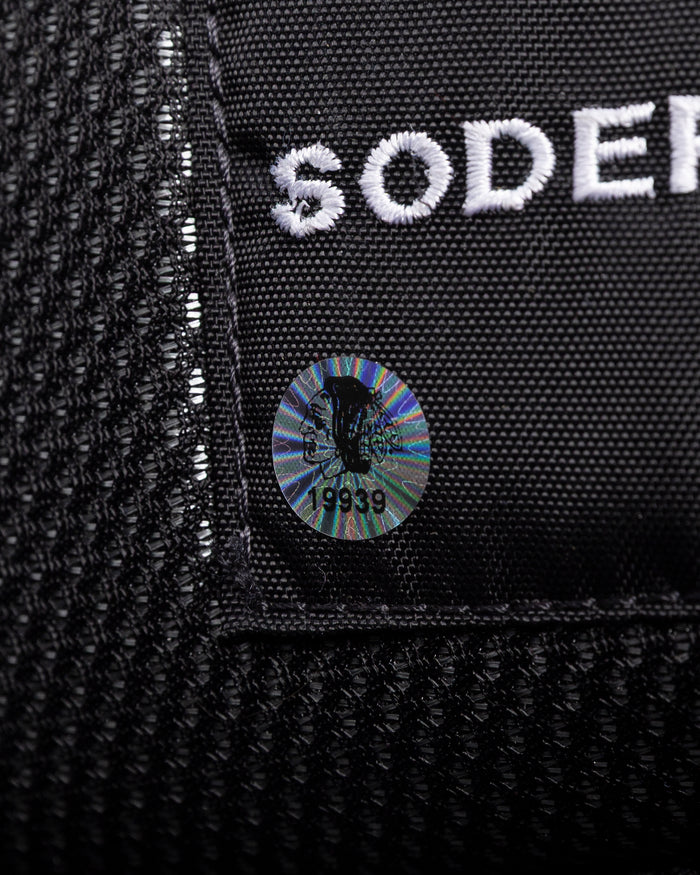 black Vaugh hockey pants used by Chicago Blackhawks goalie Arvid Soderblom - hologram sticker detail lay flat
