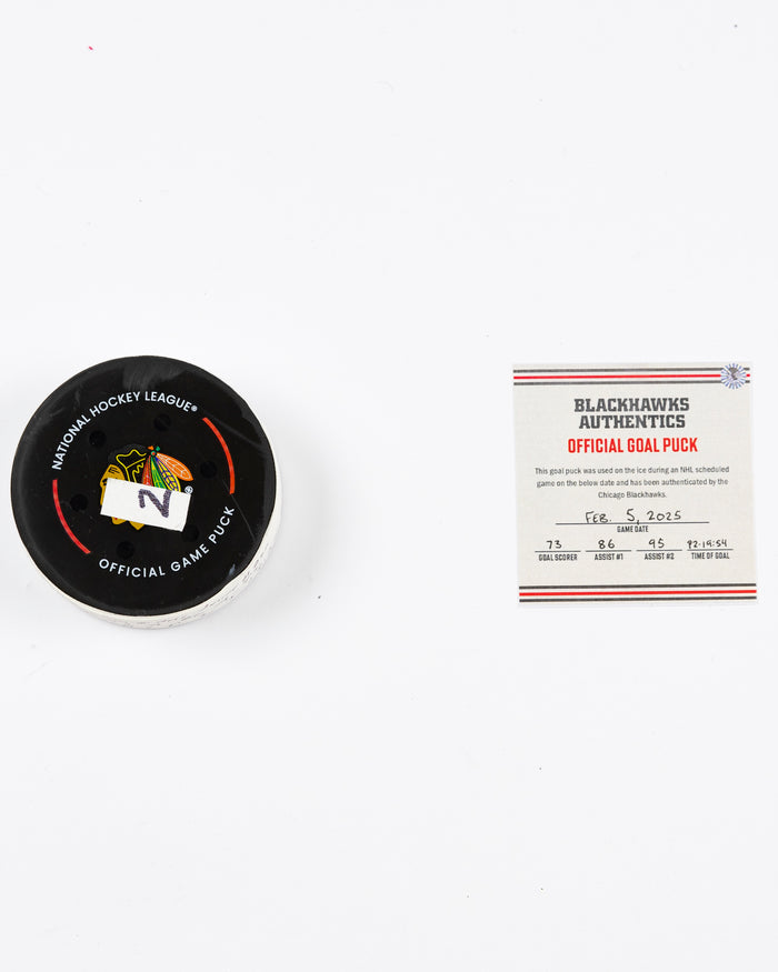 official Chicago Blackhawks game-used goal puck scored by Lukas Reichel on February 5, 2025 - front lay flat of puck and certificate