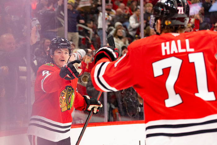 Chicago Blackhawks players Ryan Donato and Taylor Hall celebrating Donato goal against the Carolina Hurricanes on January 20, 2025