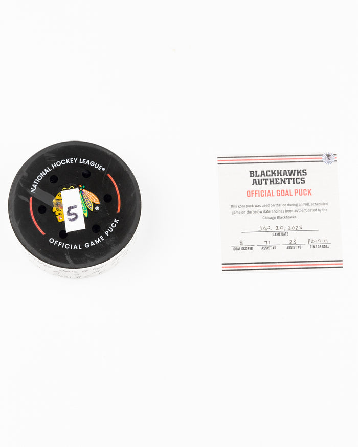 official Chicago Blackhawks game used goal puck scored by Ryan Donato against the Carolina Hurricanes on January 20, 2025 - front lay flat of puck and certificate