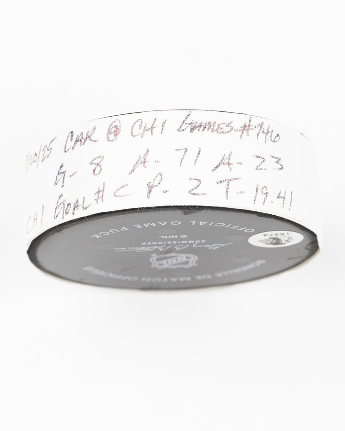 official Chicago Blackhawks game used goal puck scored by Ryan Donato against the Carolina Hurricanes on January 20, 2025 - tape detail lay flat
